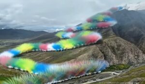'snake' of fireworks going up a mountain