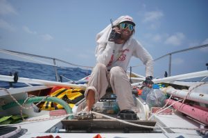 Bardelis makes a call on a satellite phone while rowing across an ocean.