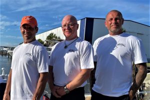 Three rowers on shore. Two of them needed rescue this week