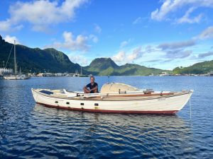 Tom Robinson in a boat.