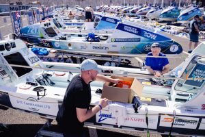 A TWAC competitor works on a boat.