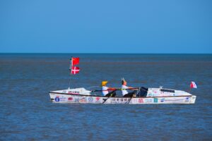 Christian Havrehed and Sun Haiban rowing.