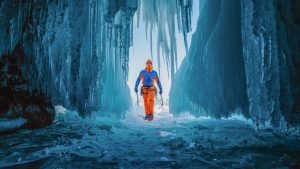 Arnold enters an ice cave on Lake Baikal Photo Mammut