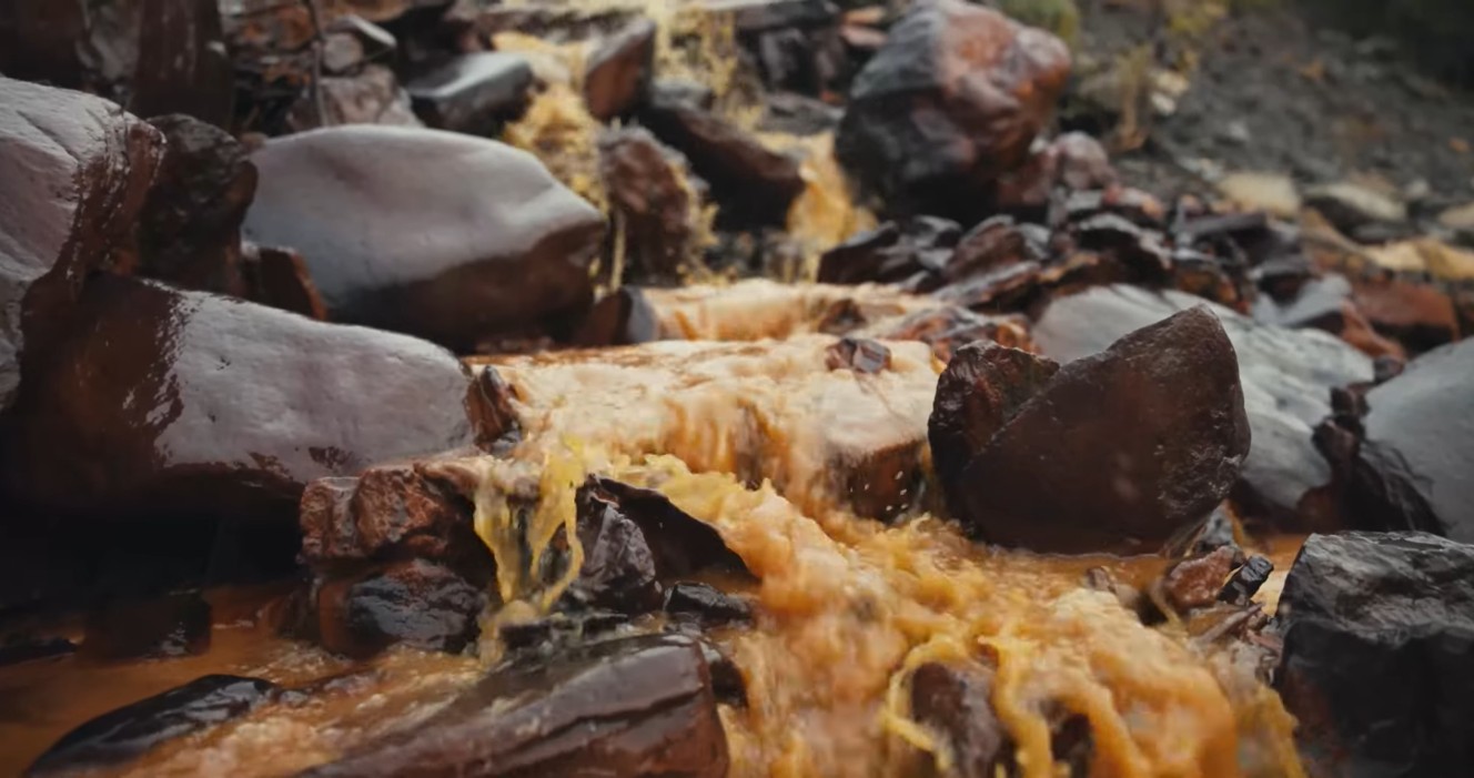 Yellow water over red rocks