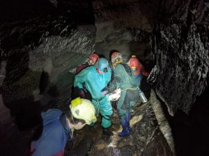 Volunteer rescuers work to extract injured caver, George Linnane. Photo: South & Mid Wales Cave Rescue Team