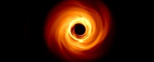 A spinning black hole graphic.