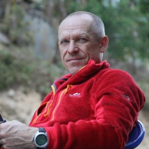 Close sot of hamor in red polar fleece, with an outdoor background.