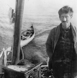 John Hornby beside his canoe