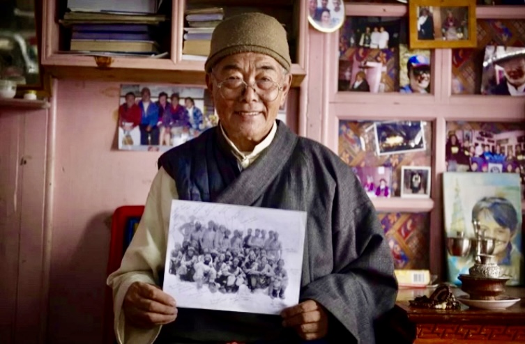 Kanchha Sherpa with the 1953 Everest team photo.