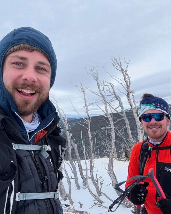 American adventurers Jacob Myers and Kyle Sprenger posing for a selfie photo on snow covered ground