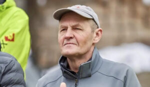 head and shoulders portrait of man in ball cap