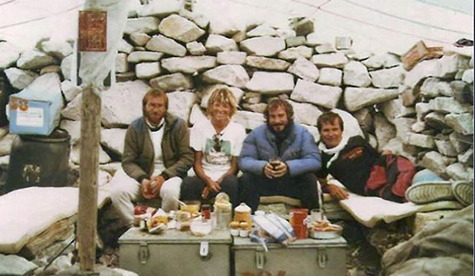 several climbers at a table spread