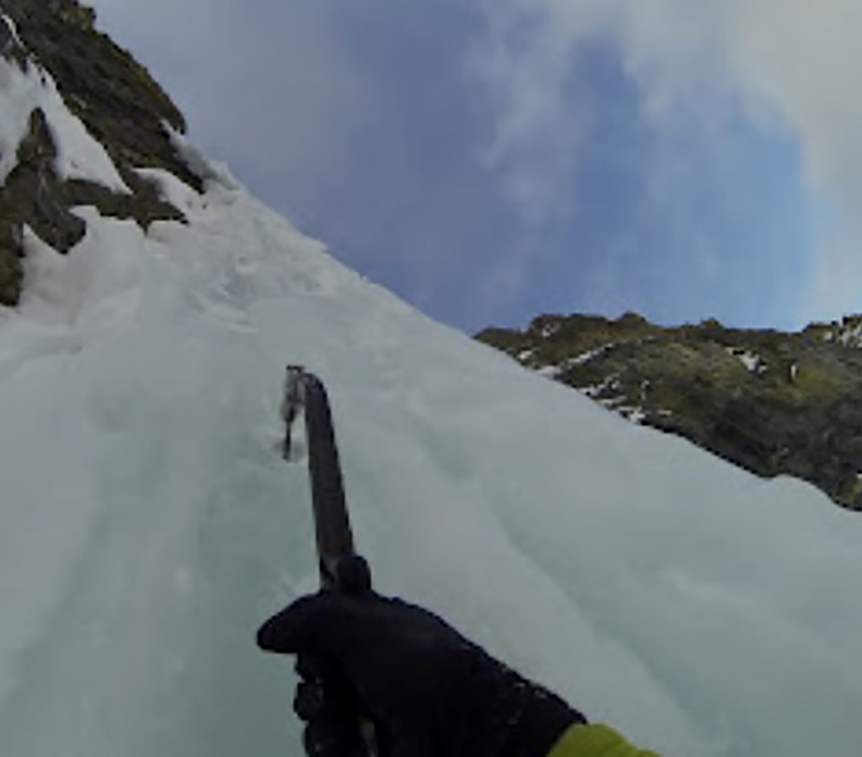 single ice ax and hand, climbin g