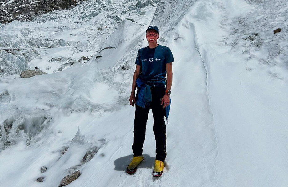 man on bright snowy mountain