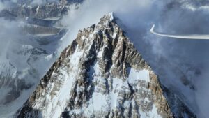 K2 with clouds behind it from the air.