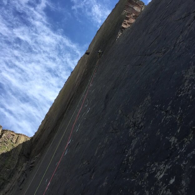 the climber up a vertical, smooth slab