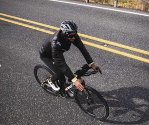 Kilian jornet on a bycicle as seen from above.