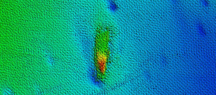 A sonar scan of a blob on the sea floor.