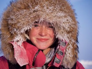 woman in fur ruff and red jacket