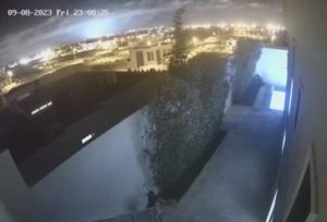 a blue flash lights up the night sky beyond Agadir, Morocco