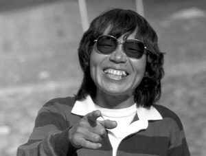 black and white portrait of woman pointing