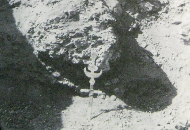 Photo of a led cross embedded in the hard ground