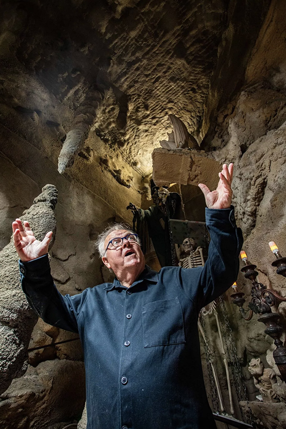 man standing in cave