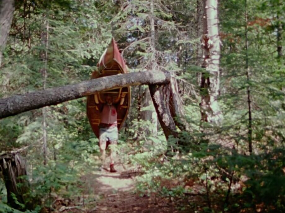 Mason carrying his canoe
