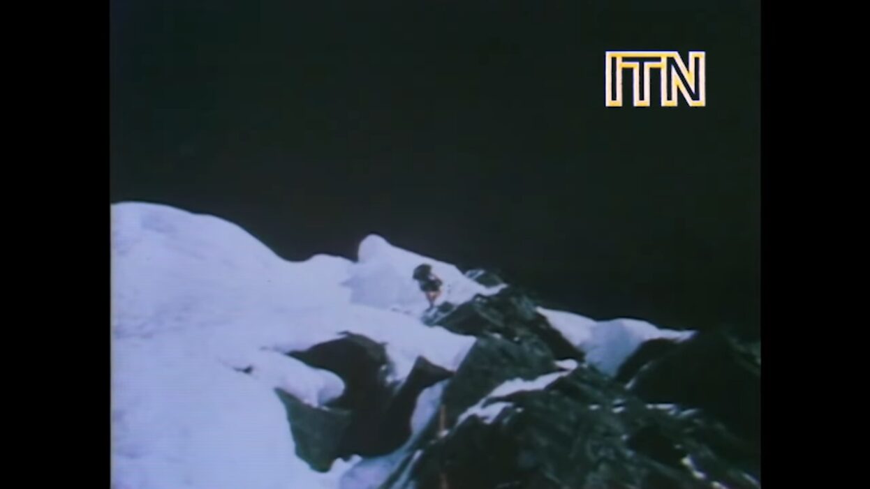 a man climbing the mountain