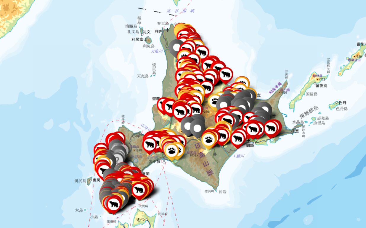 A map of Hokkaido covered in red and yellow bear icons