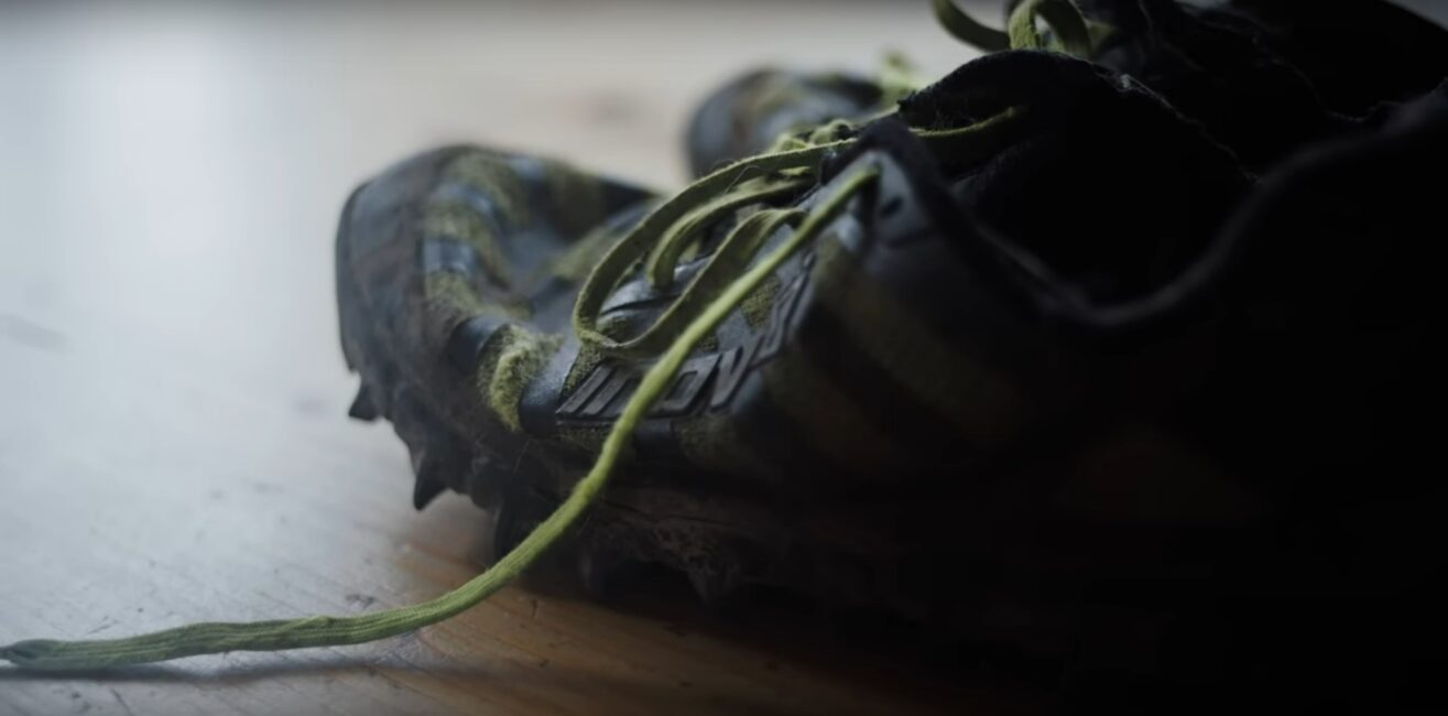 A pair of worn and battered running shoes