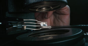 examining a diamond under a scope