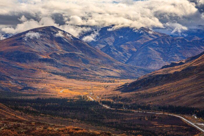 The Dempster Highway climbs through the Tombstone Mountains in Canada's Yukon Territory. 