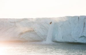 Aniol Serrasolses runs a 20m-high glacial waterfall, Svalbard.