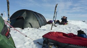 polar camp, with low-angle shot of sled and tents