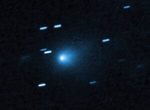 A bright blue dot among smaller blue flashes