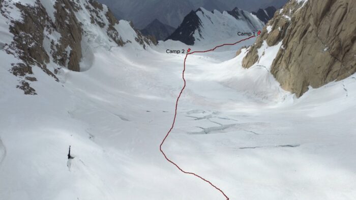 A route marked in red on a photo of Tirich Mir's glacier. 