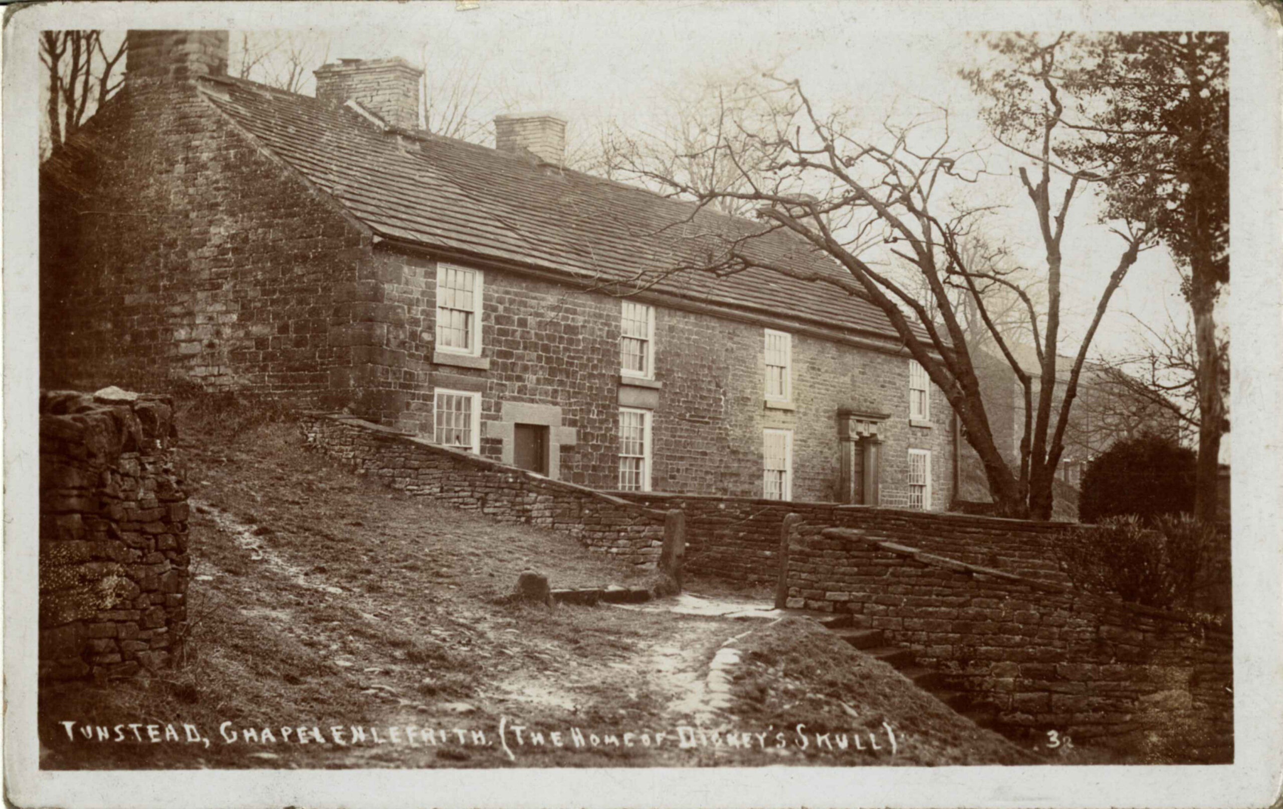 A vintage photograph of a farmhouse